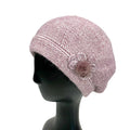 Melange Beret with Side Deco showcasing a stylish pink design and decorative side flower detail.