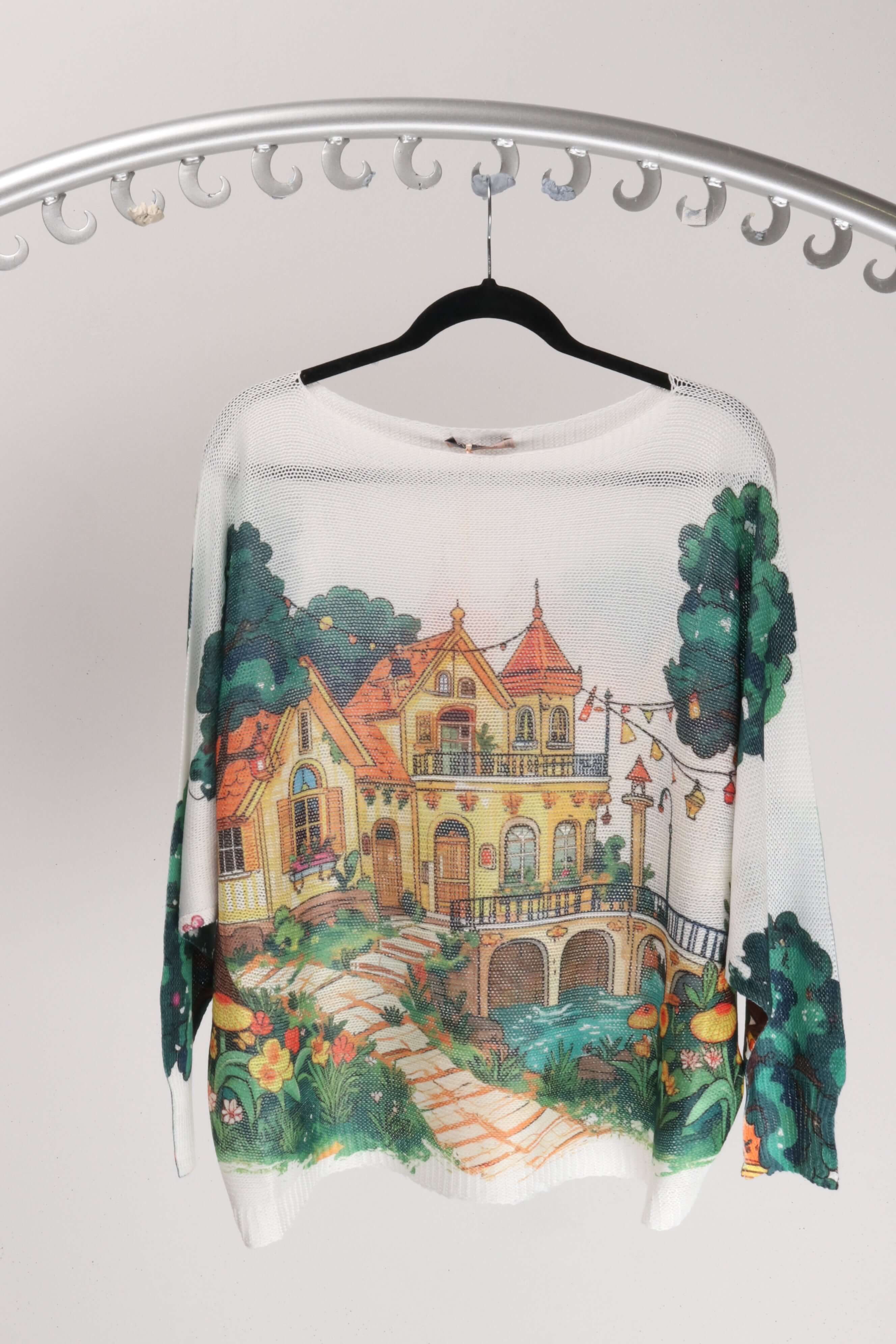 Mansion House Knit top featuring a colorful house design, lightweight knit with boat neck and bat wing sleeves.