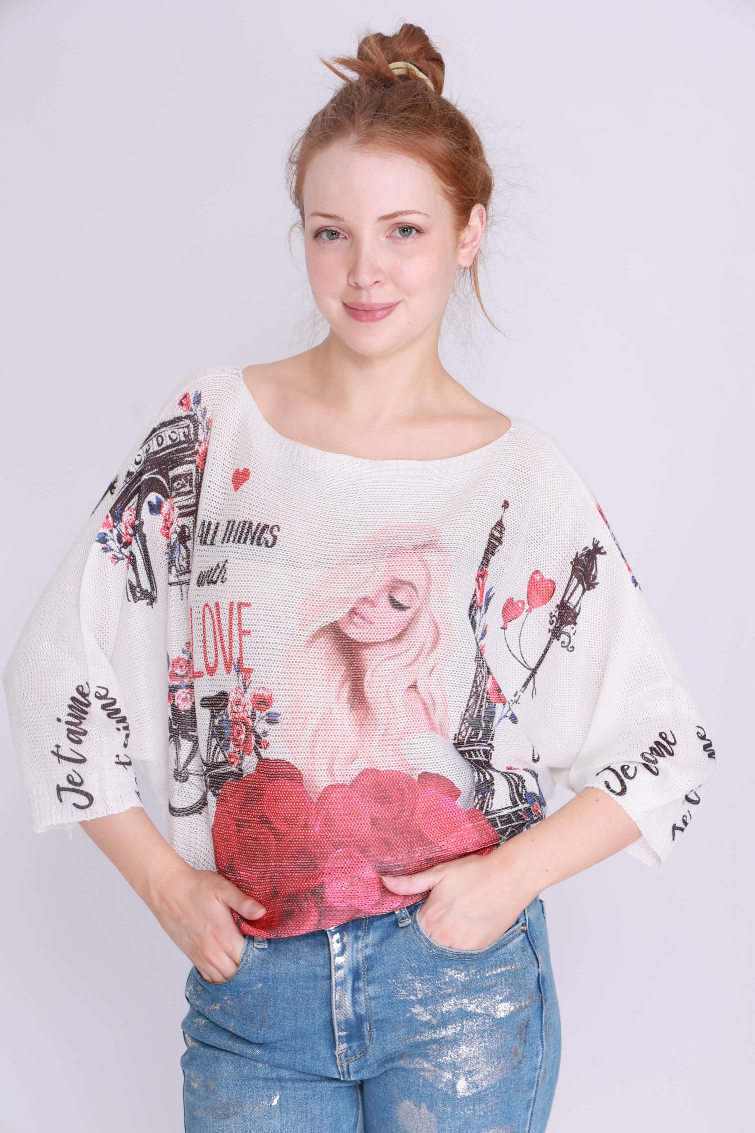 Model wearing the Je taime Paris Knit with a boat neck and bat wing sleeves, showcasing playful Parisian style.