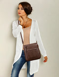 Patricia Vegan Expandable XBody Bag Choc worn by a model in stylish outfit, showcasing its versatile design.