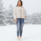Model wearing the Crissy Teddy jacket in snowy outdoor setting, showcasing cozy style and warmth.