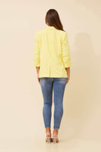 Back view of Limoncello Linen Blazer showcasing its vibrant lemon yellow color and elegant silhouette.