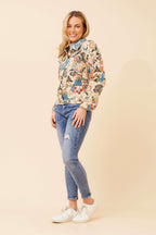 CKM Tapestry Jacket paired with jeans, showcasing vibrant floral patterns and a chic style for any season.