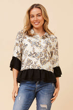 Jaipur Shirt featuring a floral design with ruffled sleeves in cream and black, perfect for stylish casual occasions.