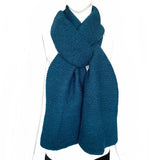 Kamala Knitted Scarf displayed on a mannequin, showcasing a cozy and stylish design, made of soft viscose.