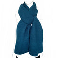 Kamala Knitted Scarf displayed on a mannequin, showcasing a cozy and stylish design, made of soft viscose.