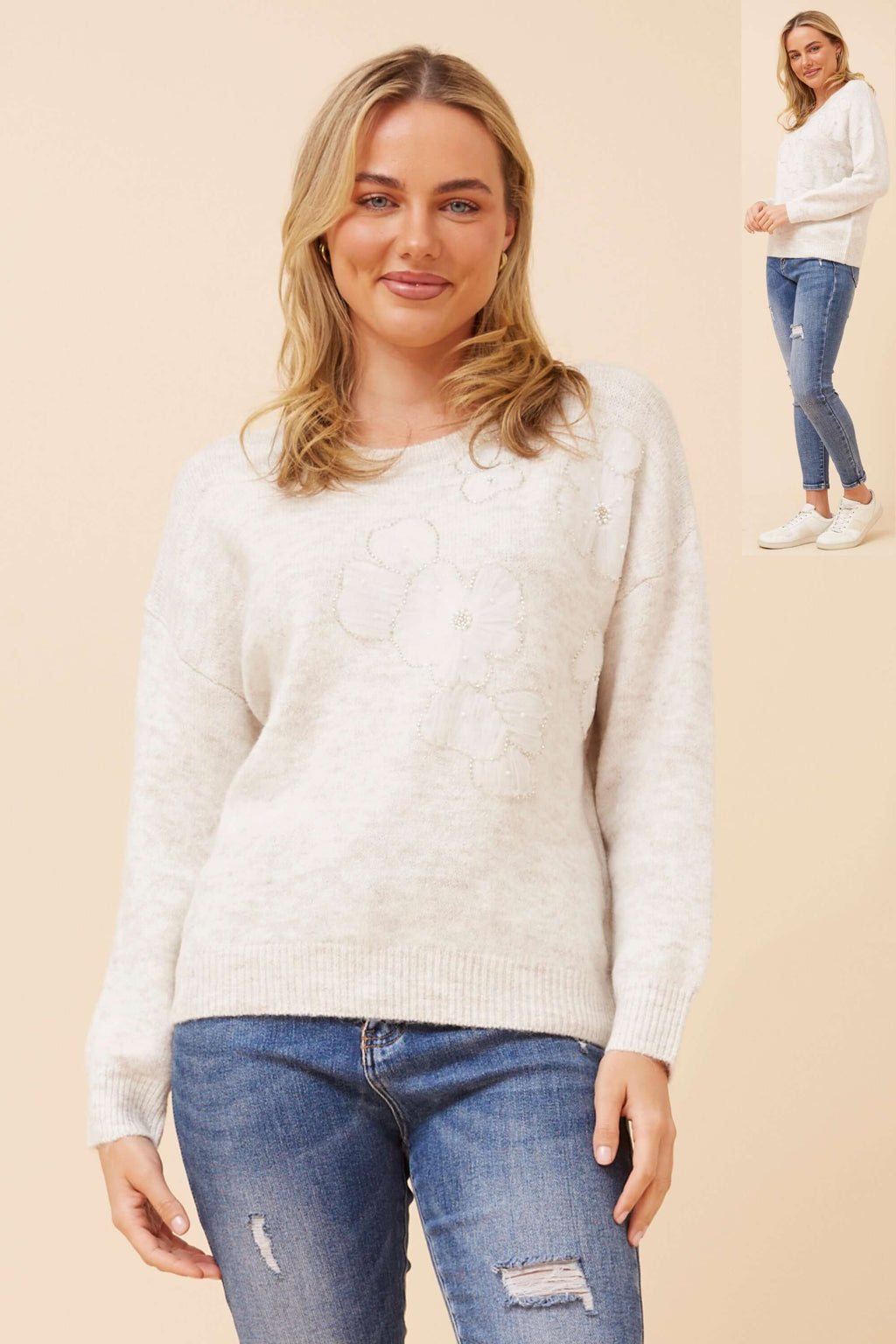Model wearing the Erica Applique Knit in soft oatmeal with floral appliqué details.