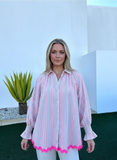 Model wearing a KL Ric Rac Shirt with pink stripes and a vibrant pink ric rac hem, perfect for warm, stylish days.