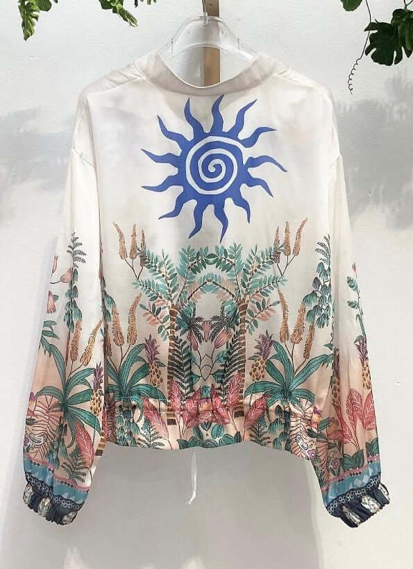 Caterina Zip jacket featuring colorful tropical print and sun design, perfect for versatile layering.