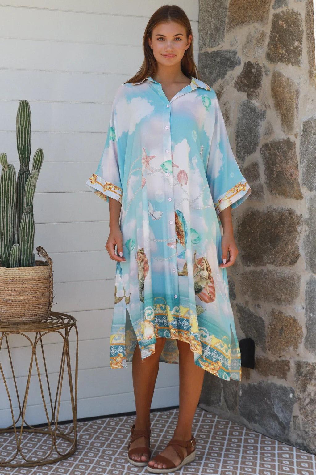 Cameron Shirt Dress in light blue with seashell prints, featuring a button front and roomy cut for a casual chic look.