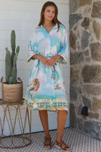 Cameron Shirt Dress featuring a vibrant sea-themed print, perfect for a casual summer outing.