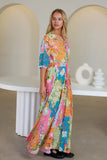 Model wearing the Iris Maxi Dress with vibrant floral print and V-neckline, showcasing its beautiful design and comfy fit.