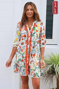 Chiara 3/4 sleeve Mini Dress featuring colorful floral print and Ric Rac details, perfect for summer fashion.