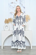 Palm Dress featuring long sleeves, V-neckline, drawstring waist, and navy palm print on off-white fabric.