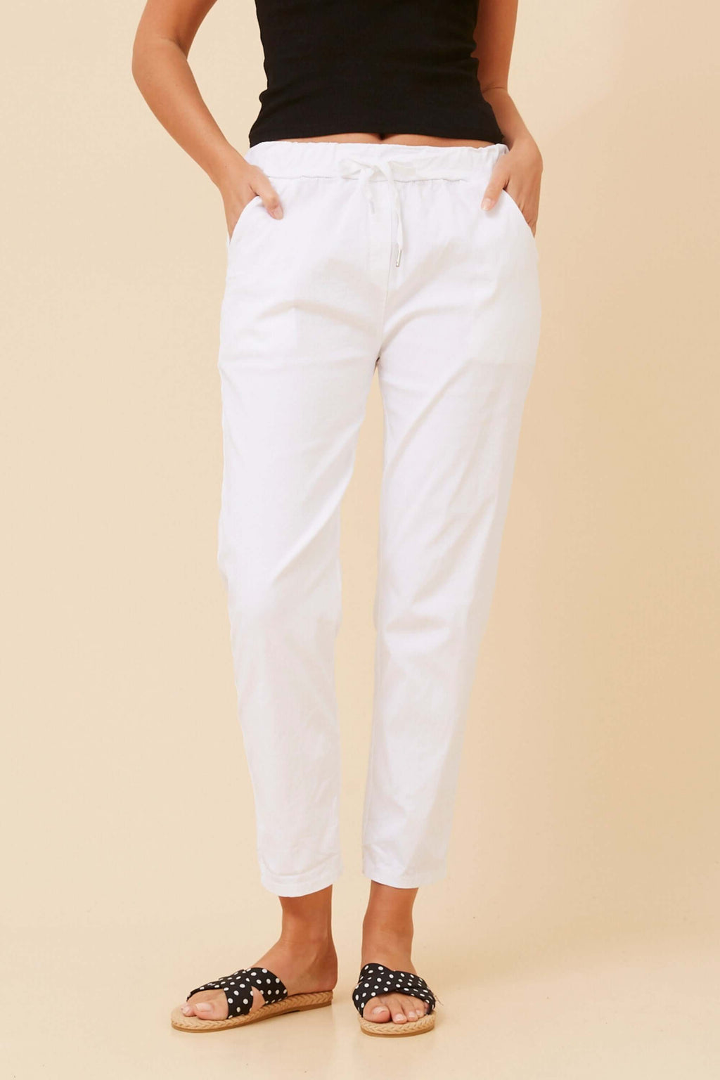 Ivana Crop Pants in white, featuring a relaxed fit and elastic waist, perfect for warm weather.