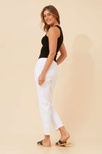 Model wearing Ivana Crop Pants, showcasing the stylish back view with a relaxed fit and chic white color.