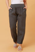 Model wearing Roma Linen Pants with elastic waistband and front pockets, showcasing Italian craftsmanship and comfort.