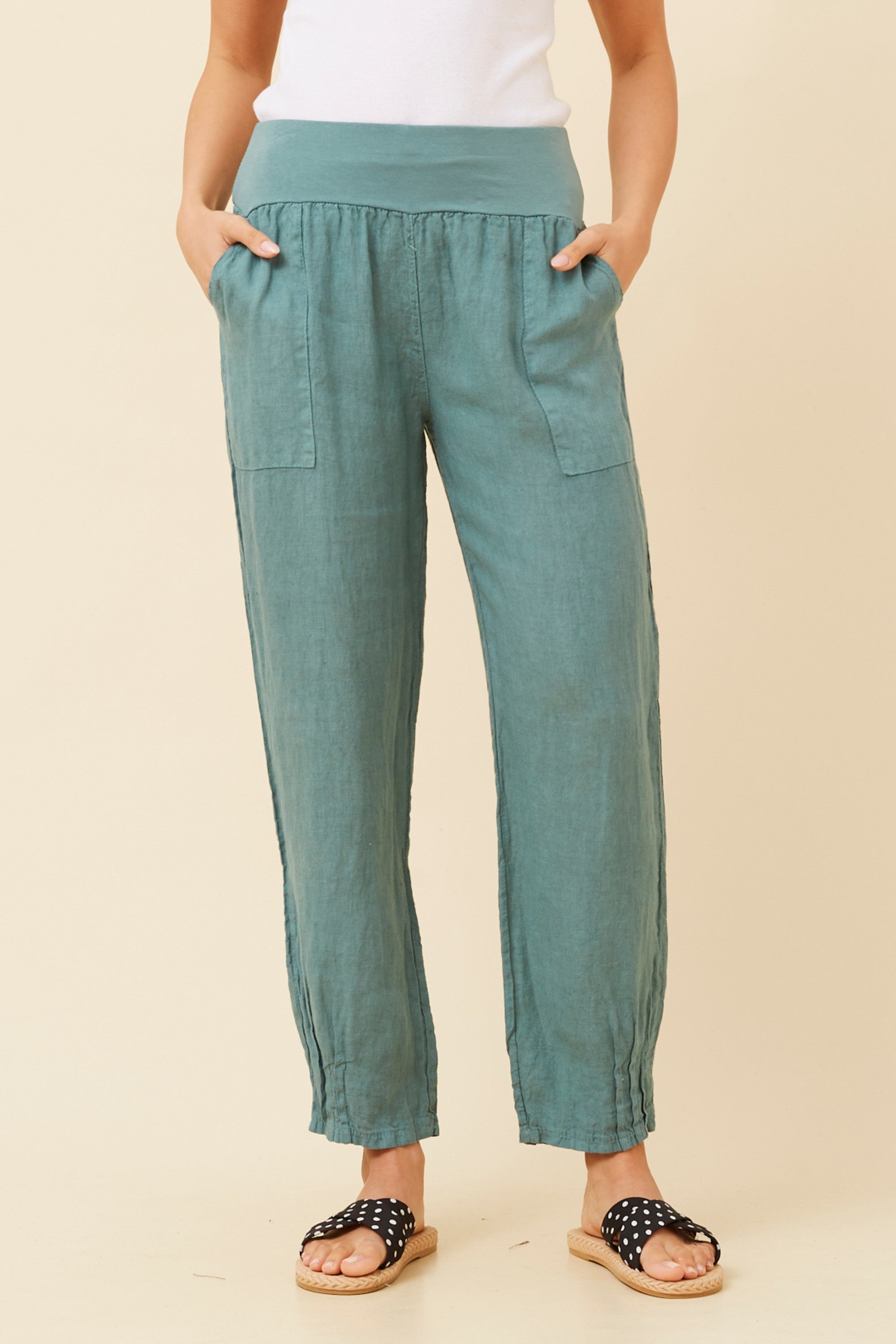 Roma Linen Pants in teal with elastic waistband and front patch pockets, perfect for warm weather elegance.