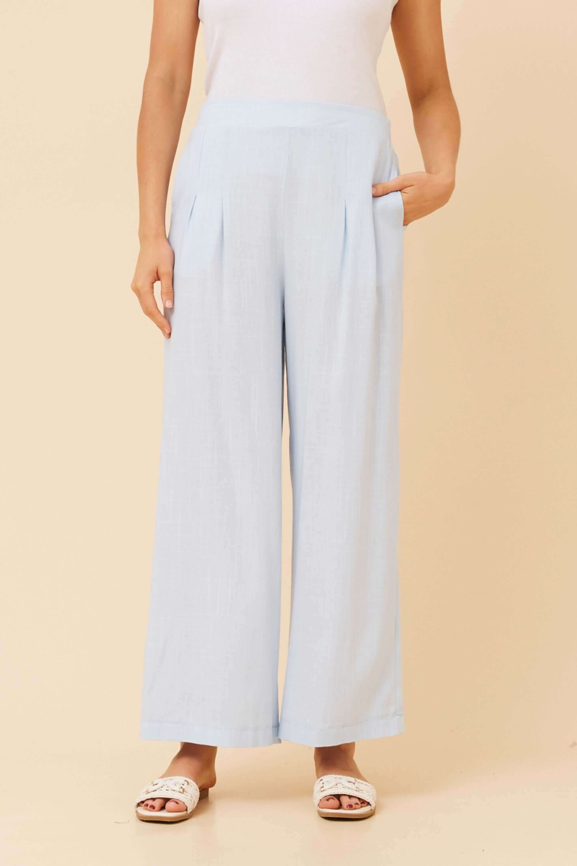Linen Blend Wide Pants in light blue with elegant pleats and pockets, perfect for warm weather style.