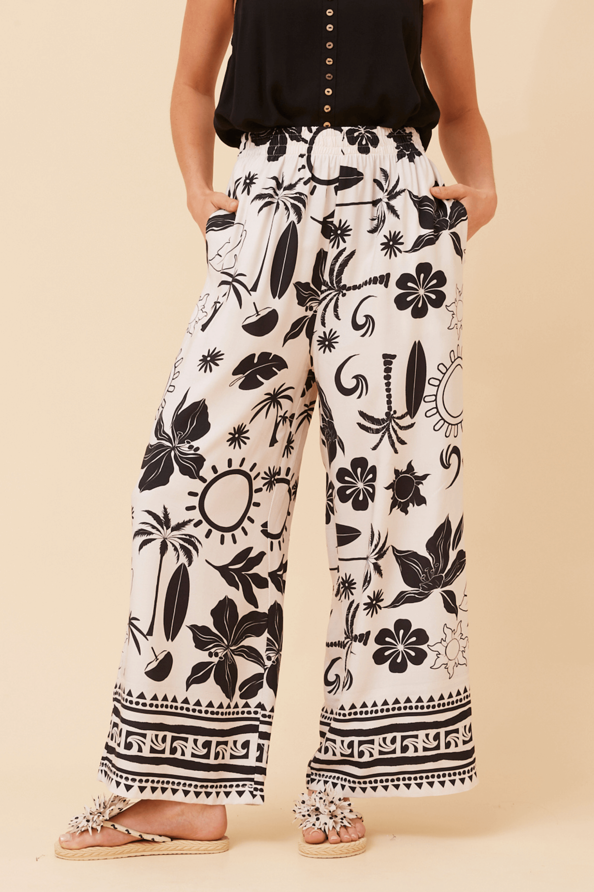Bahama Pants featuring a striking cream base with bold black print and wide leg silhouette for all-day comfort.