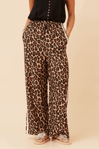 Wildcat Racer Pants featuring a leopard print design, wide leg silhouette, and double stripe detail for sporty sophistication.