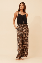Wildcat Racer Pants featuring a relaxed fit, leopard print design, and sporty double stripe detail.