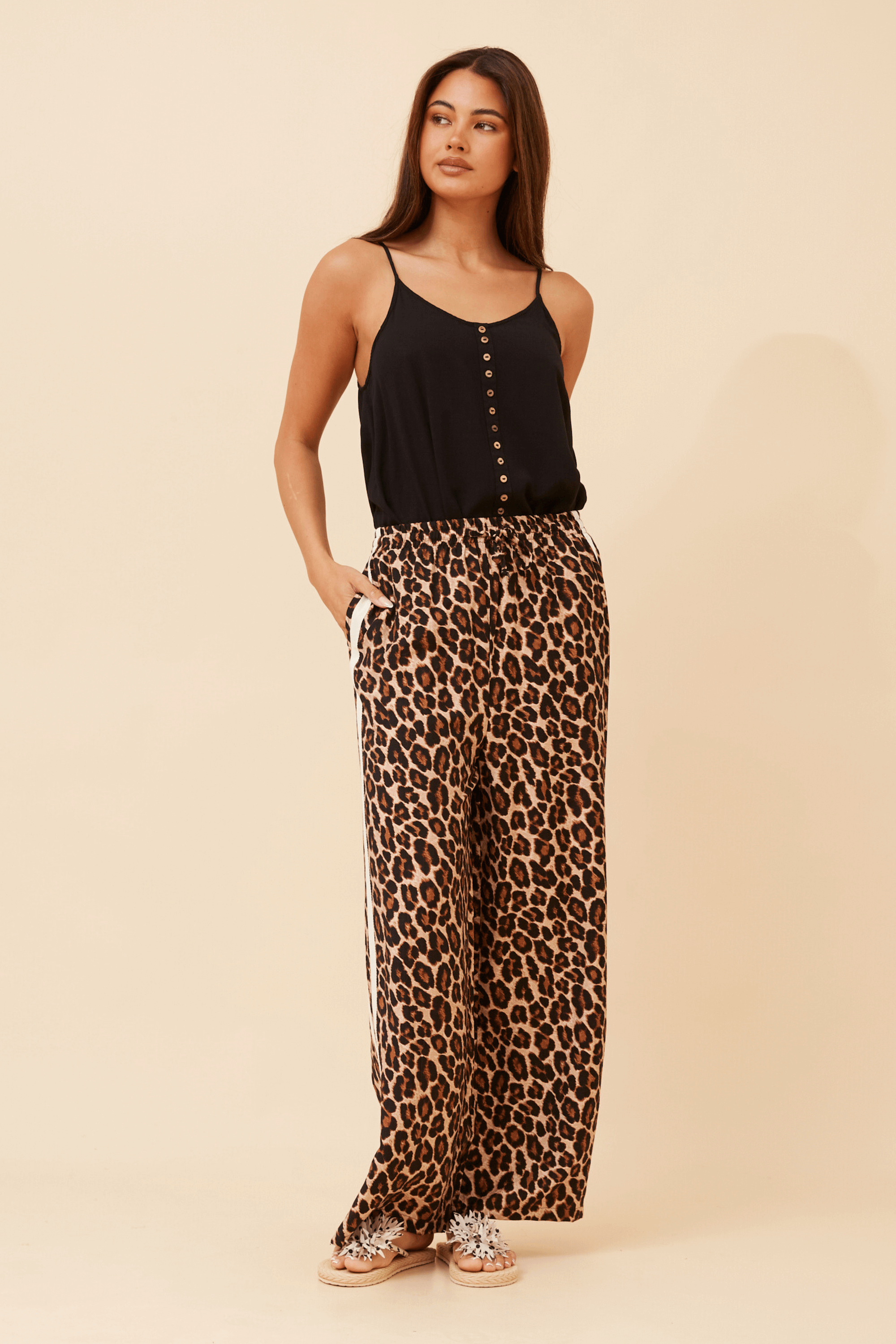 Wildcat Racer Pants featuring a relaxed fit, leopard print design, and sporty double stripe detail.