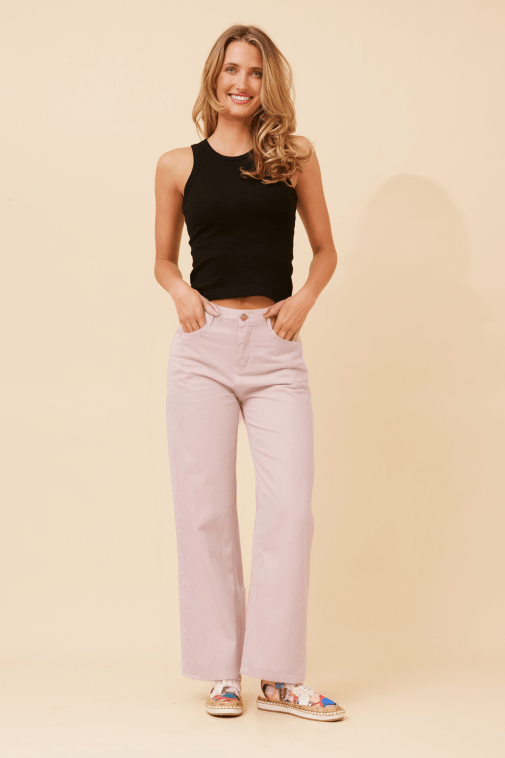 Ronja Wide leg Jeans shown in a stylish outfit with a black tank top and patterned shoes on a light background.