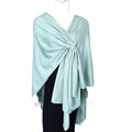 Cross Front Cape elegantly styled, offering versatility and luxury in fine knit craftsmanship.