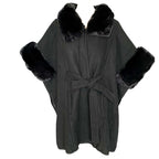 Anya Cape featuring luxurious faux fur trim and collar, stylish poncho with belt tie and practical pockets.