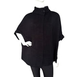 Elegant Cape with Button in black, showcasing soft acrylic knit and relaxed silhouette for versatile styling.