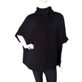 Elegant Cape with Button in black, showcasing soft acrylic knit and relaxed silhouette for versatile styling.