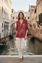Model wearing the WL Amedea Sequin Pocket top near a picturesque canal in Venice.