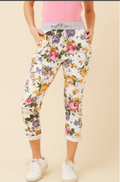 Model showcasing Crop Floral Joggers with vibrant floral print, elastic waist, and pockets, perfect for casual wear.
