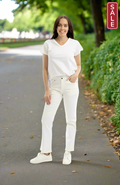 Model wearing Orientique White Denim Bootleg Jean with a white t-shirt and sneakers in a park setting.