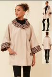 Soha Short Coat - Italian Leopard Trim Coat in chic beige with leopard print collar and cuffs, modeled elegantly.