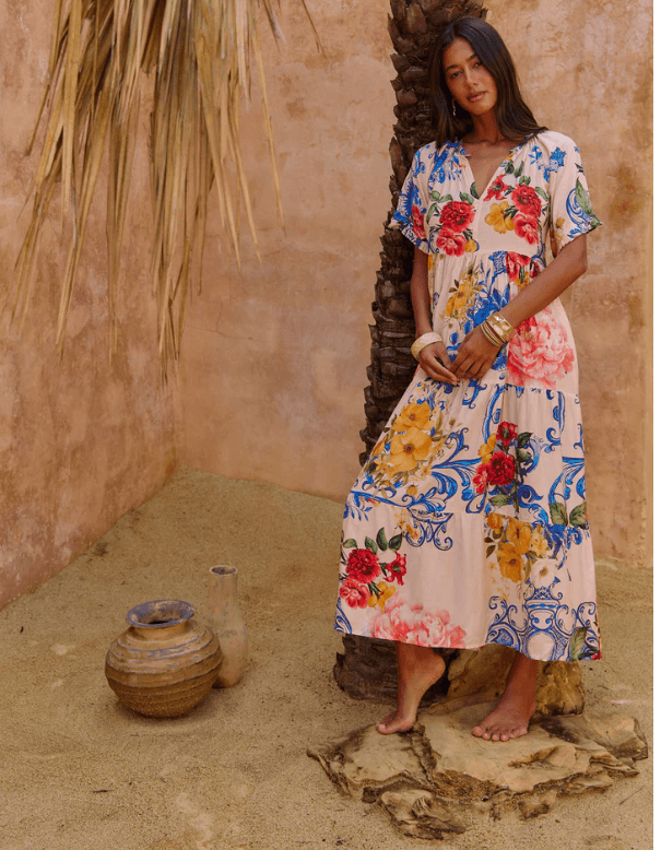 Model wearing Amisha Maxi in Tangier with floral design by NAUDIC, showcasing layered style and a relaxed vibe.