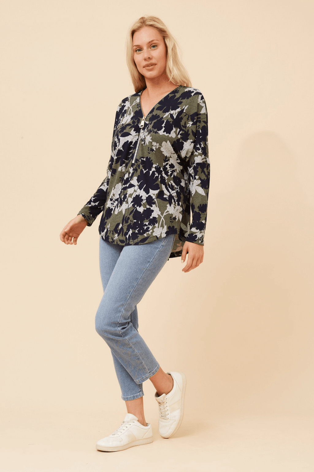 Valery Zip Top in stylish floral print, featuring a flattering V-neckline and half zipper detail.