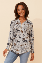 Leonor Cat Zip Top featuring playful cat print and sporty half-zip design on a relaxed fit.