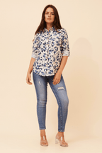 Zola Leopard Shirt styled with skinny jeans, showcasing its sophisticated long sleeve design and chic appearance.