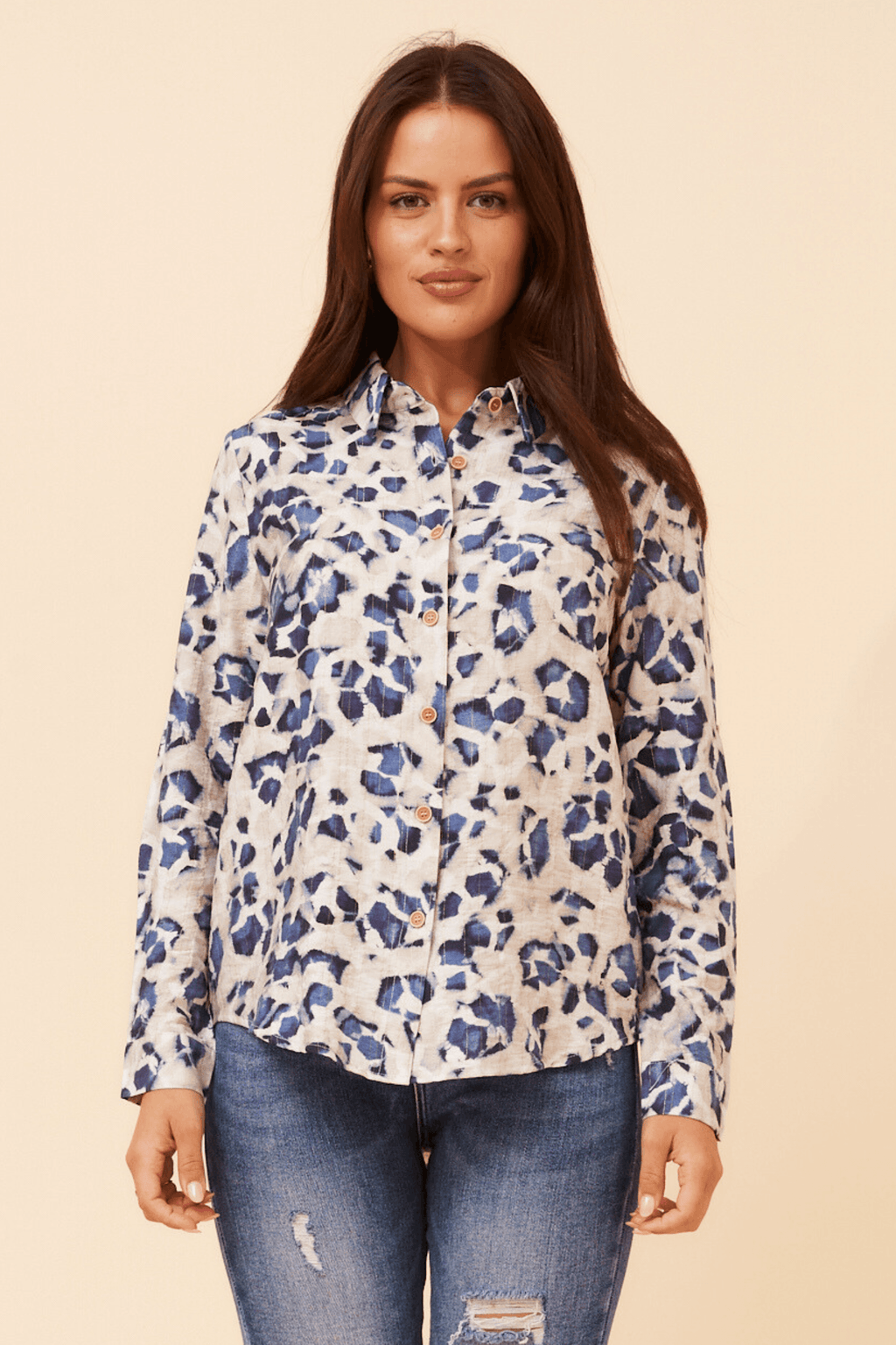Model wearing the Zola Leopard Shirt styled with jeans on a neutral background.