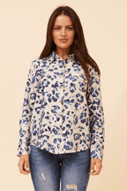Model wearing the Zola Leopard Shirt styled with jeans on a neutral background.