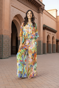 Oriental Digital Boxy Top worn with flowy pants in a vibrant, colorful setting, showcasing relaxed style and comfort.