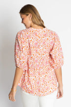 Back view of the relaxed Michigan Top featuring floral print and elbow sleeves for effortless style.