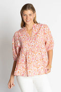 Michigan Top featuring a pink floral pattern, relaxed fit, and stylish V-neckline for laid-back days.