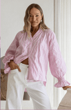 Model wearing the JG Sorrento Shirt in pink with relaxed fit, showcasing effortless coastal sophistication.