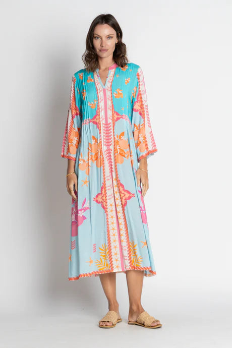 Espacio Midi Lagoon dress in vibrant lagoon print, featuring relaxed silhouette and bodice tucks for effortless style.