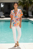 Model showcasing the Quintana Top by Lulasoul, a vibrant viscose blouse with a Nehru collar by the poolside.