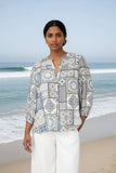 SIS Mosaic Tile Blouse featuring a relaxed fit by the beach in soft beach tones with three-quarter sleeves.
