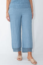 Model wearing Pari Linen Pants in light blue, showcasing relaxed fit and elegant design for casual and elevated occasions.